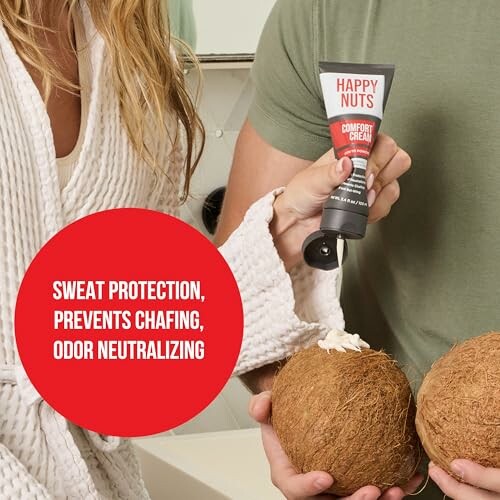 Person applying Happy Nuts comfort cream onto coconuts.