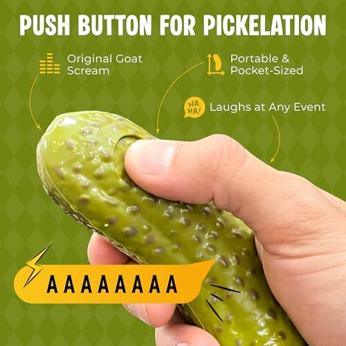 Hand holding a pickle-shaped toy with humorous features highlighted.